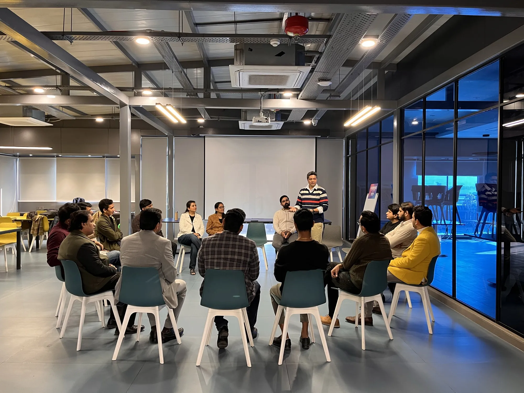 Founders and CXOs seated in a circle at a past Compass workshop